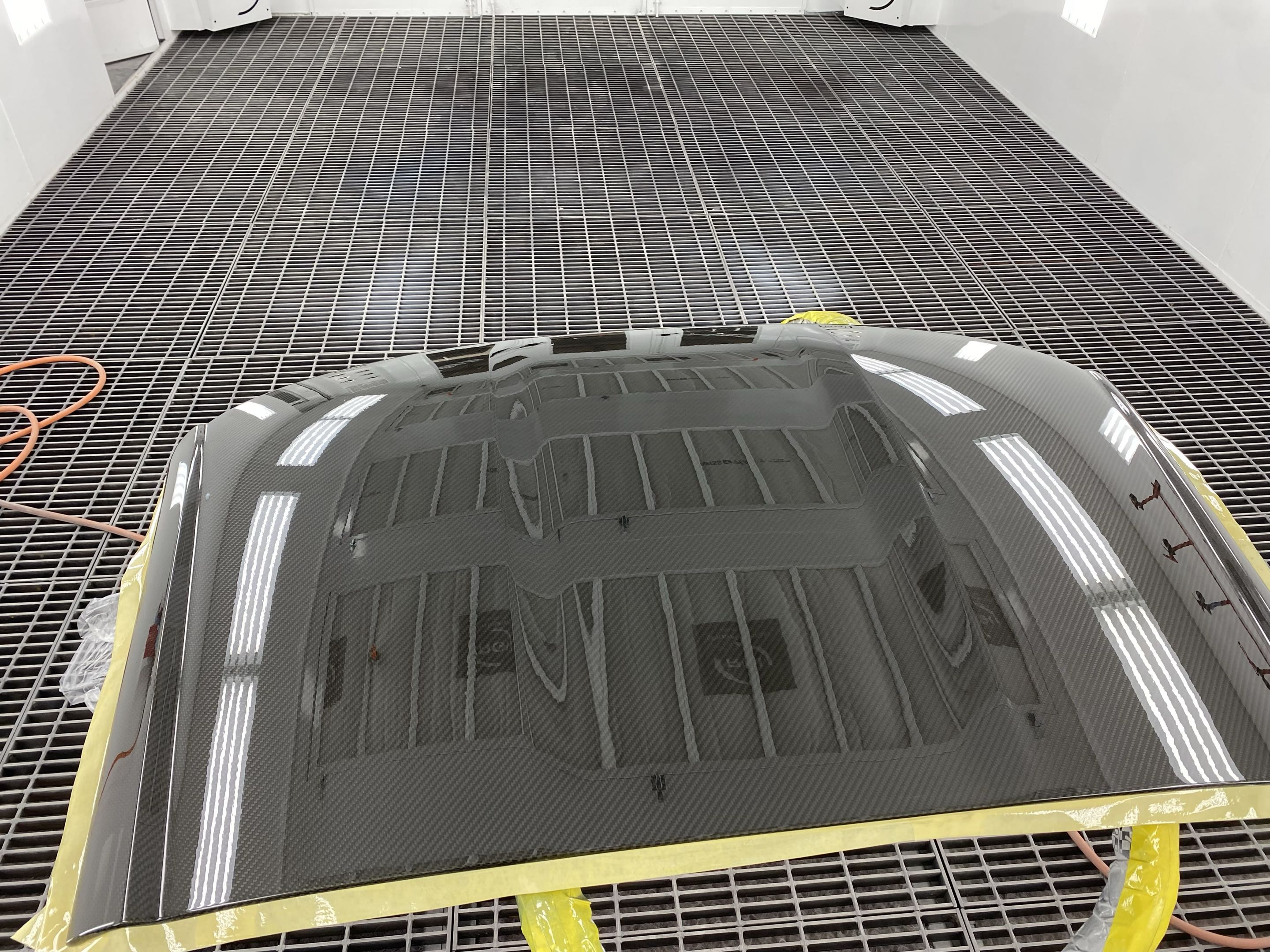 After — corrected, glossy carbon fiber hood